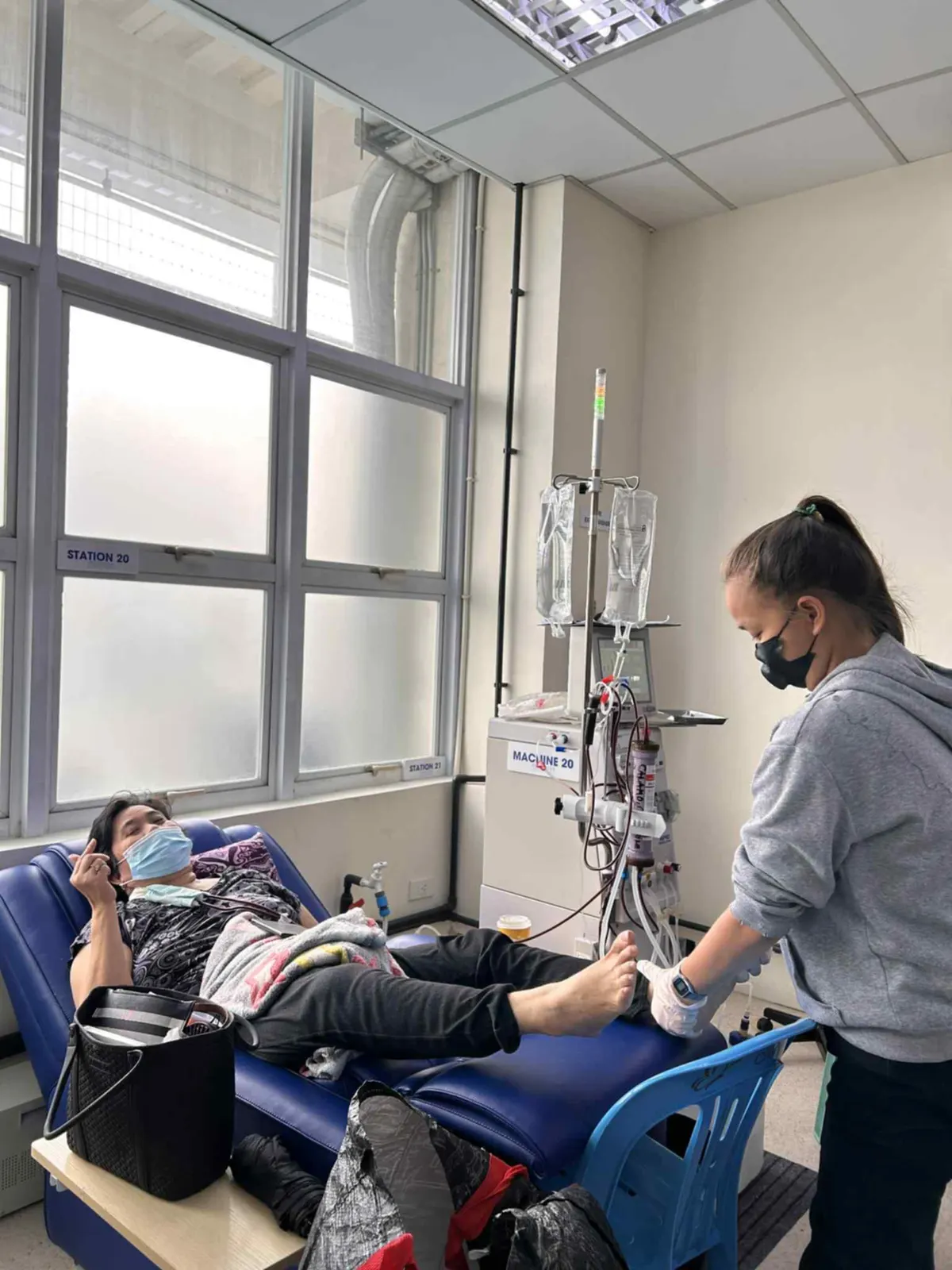 A patient enjoying a free massage during dialysis